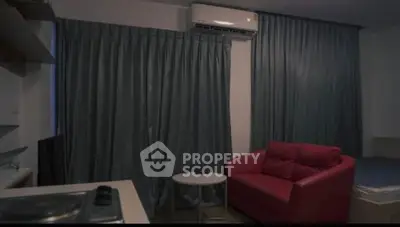 Cozy studio apartment with modern furnishings and air conditioning, perfect for urban living.