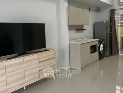 Modern kitchen with sleek cabinetry and appliances in a stylish apartment.