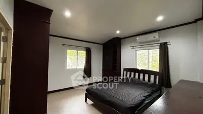 Spacious bedroom with modern design and natural light