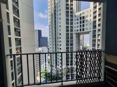 Stunning cityscape view from a modern high-rise balcony, perfect for urban living enthusiasts.