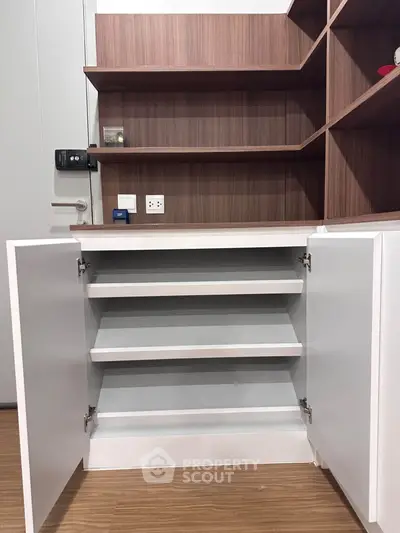 Modern storage cabinet with open shelves and sleek design in a contemporary home interior.