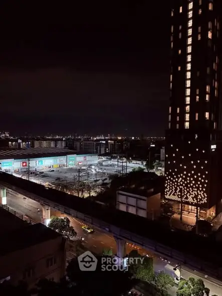 Stunning night view of a cityscape with illuminated buildings and vibrant skyline.