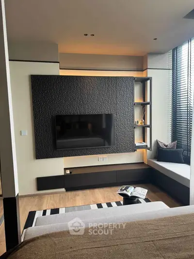 Modern living room with stylish TV wall and cozy seating area