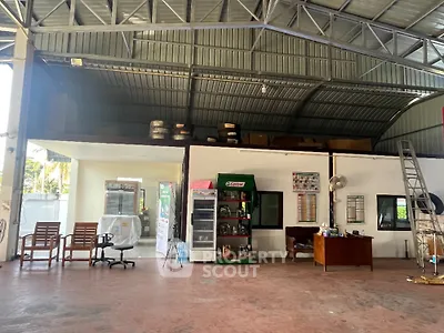 Spacious industrial warehouse with office space and high ceiling