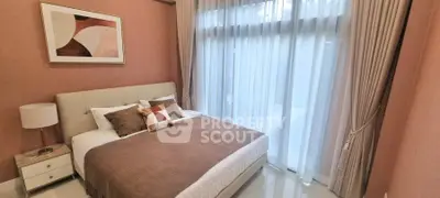 Elegant bedroom with modern decor and large window for natural light