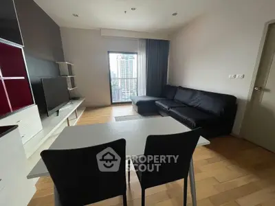 Modern living room with sleek furniture and city view from window