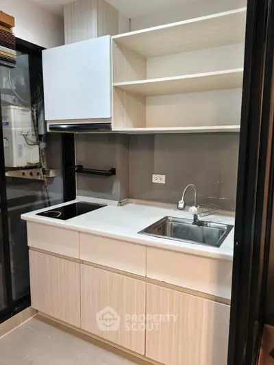 Modern kitchen with sleek cabinetry and built-in appliances, perfect for urban living.