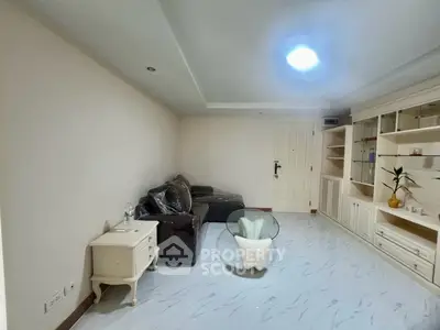 Spacious living room with modern furniture and built-in shelving
