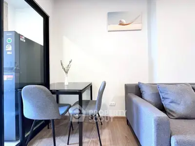 Modern living room with sleek furniture and dining area