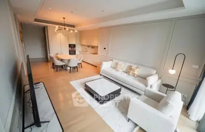Luxurious open-plan living room with modern kitchen and elegant furnishings