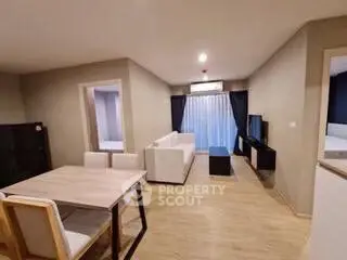 Spacious modern living room with elegant dining area and natural light