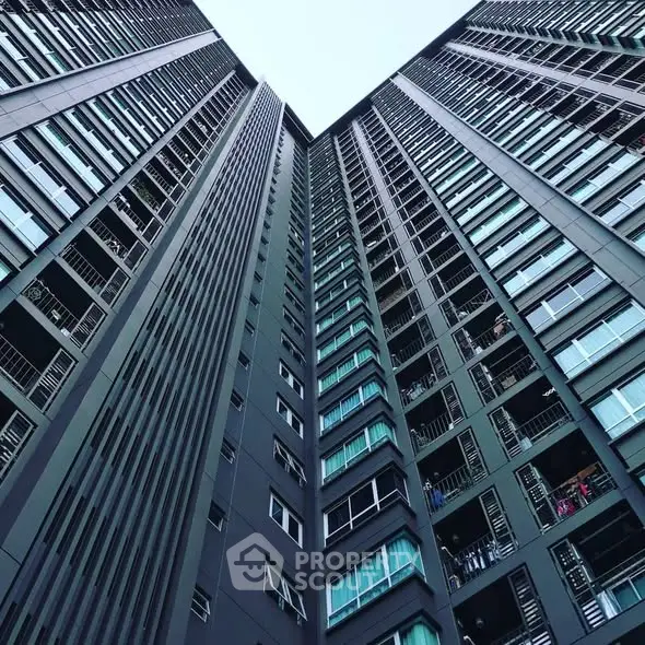 Stunning view of modern high-rise building with sleek architecture and expansive windows.