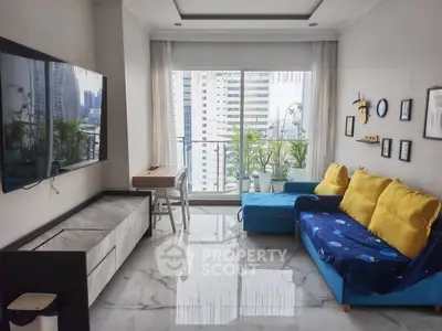 Modern living room with city view, stylish decor, and large TV, perfect for urban living.