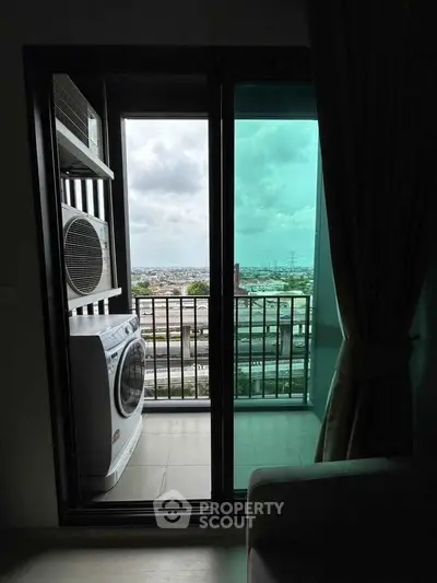 Modern balcony with washing machine and city view, perfect for urban living.