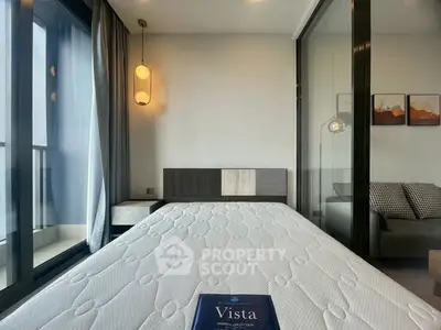 Modern bedroom with large windows and stylish decor in a high-rise apartment.