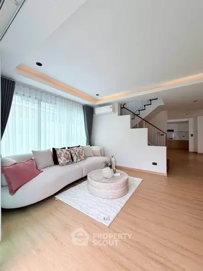 Spacious modern living room with elegant decor and natural light
