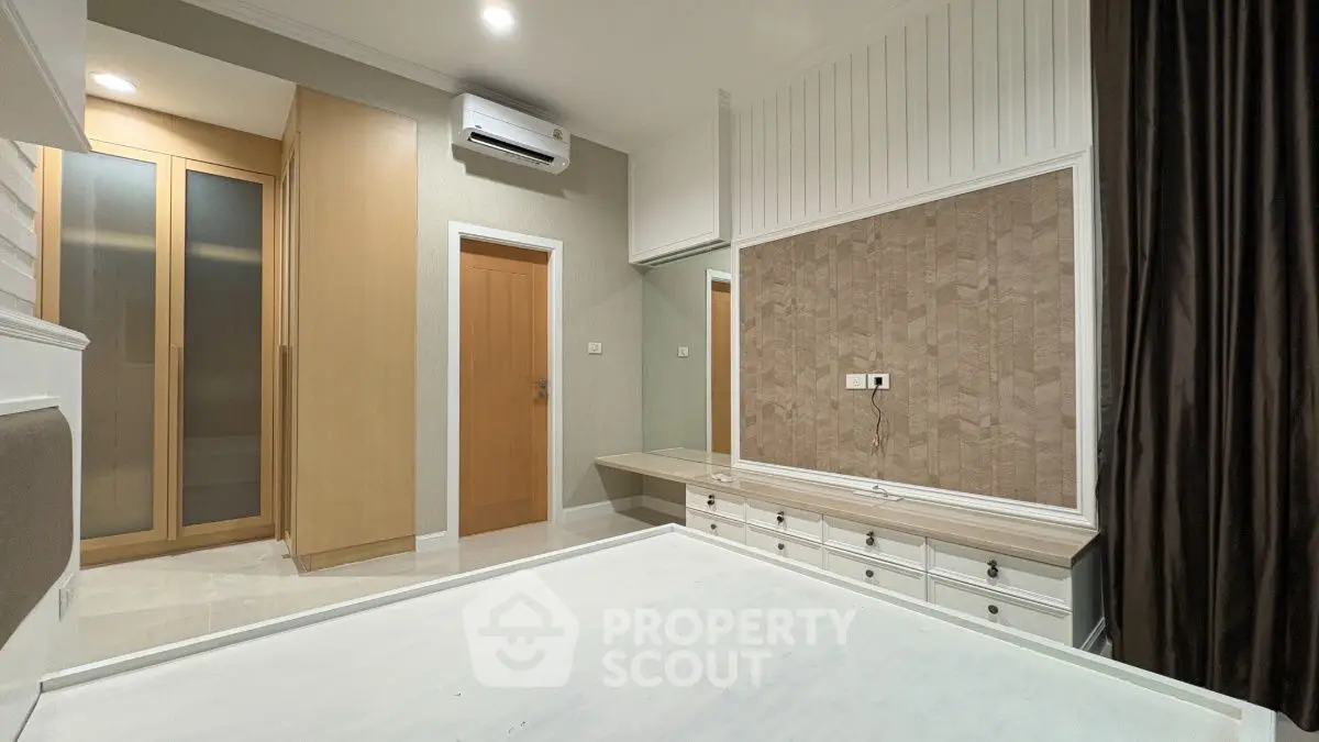 Spacious bedroom with modern design and built-in storage solutions