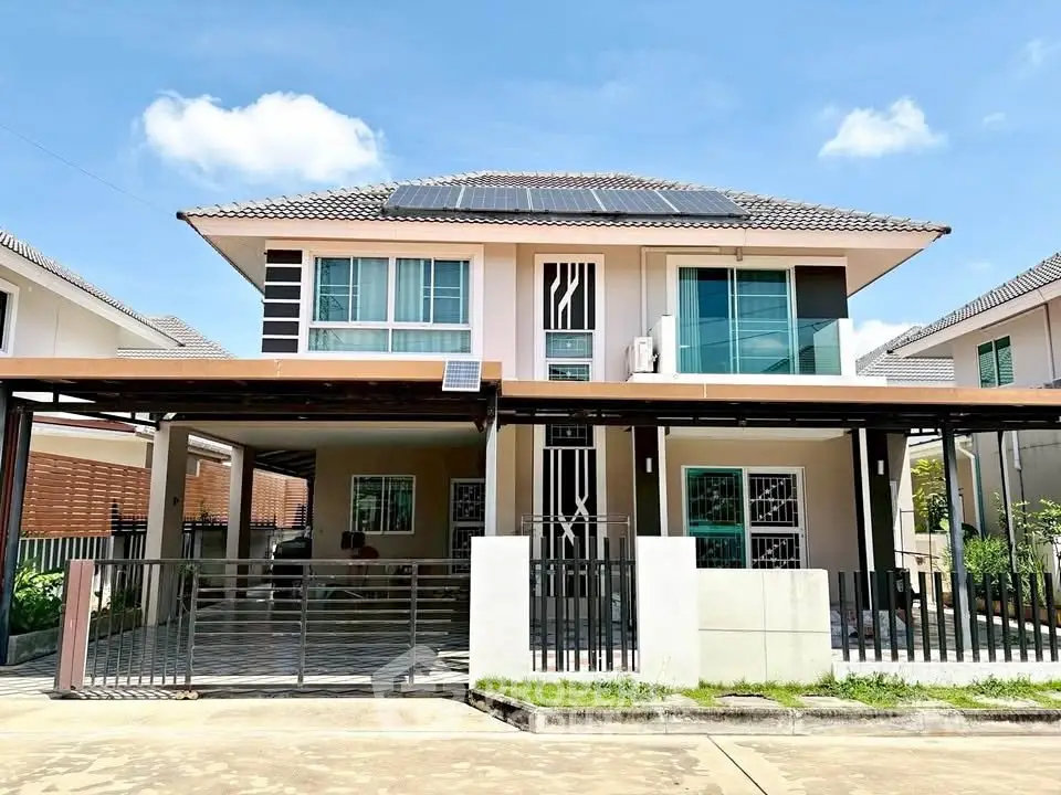 Modern two-story house with solar panels and spacious driveway