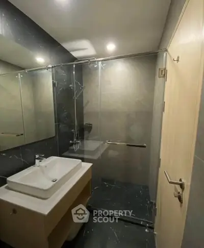 Modern bathroom with sleek design and glass shower enclosure
