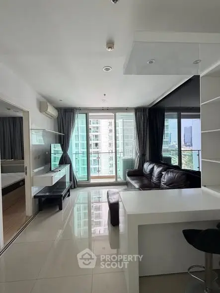 Modern living room with sleek design and city view from large windows