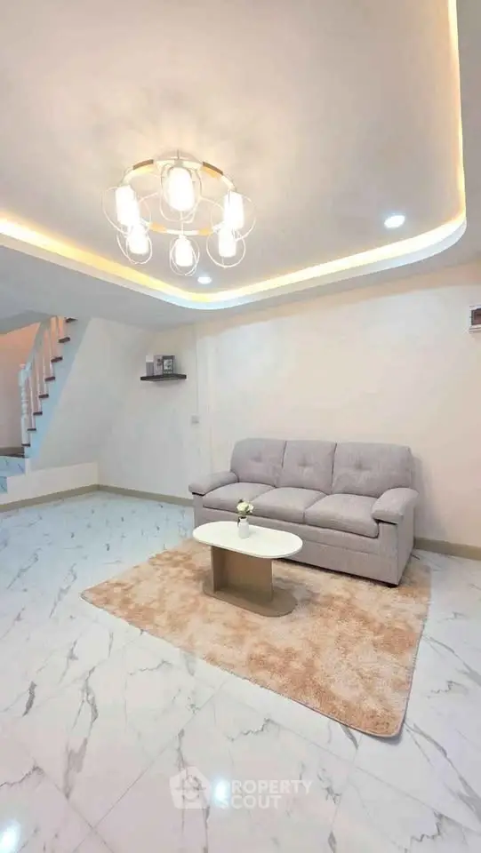 Modern living room with elegant lighting and cozy sofa on marble floor