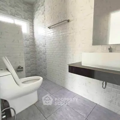 Modern bathroom with sleek fixtures and stylish tile design