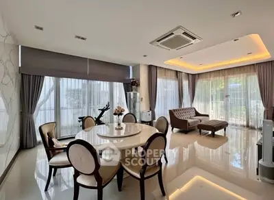 Luxurious living room with elegant dining area and modern decor