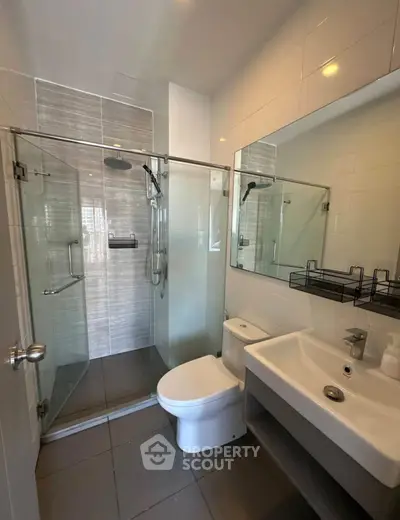 Modern bathroom with glass shower and sleek fixtures