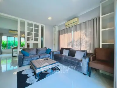 Spacious living room with modern furniture and large windows