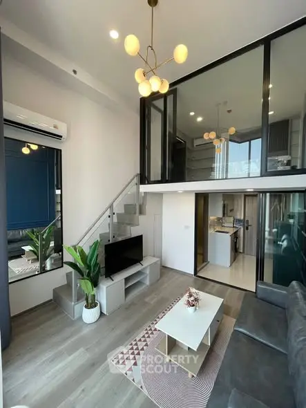 Modern duplex living room with stylish decor and open kitchen layout
