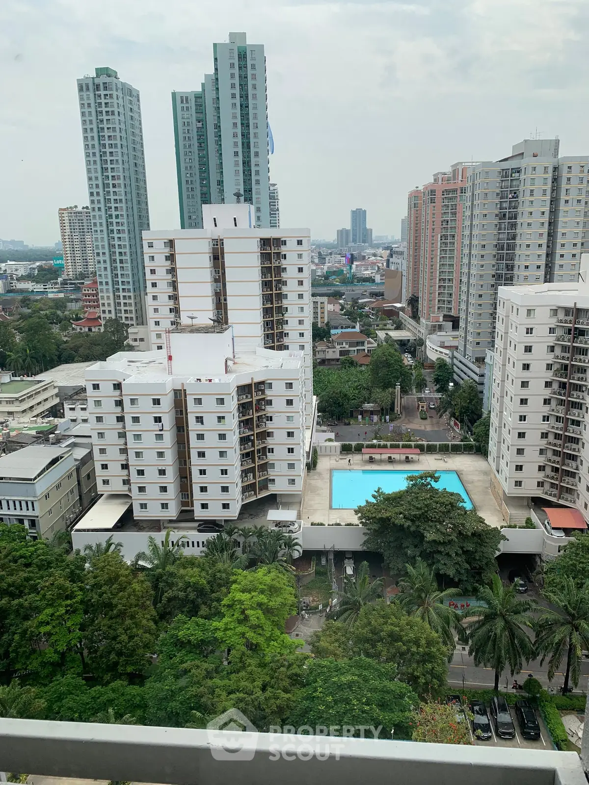 Stunning cityscape view with high-rise buildings and a refreshing pool, perfect urban living.