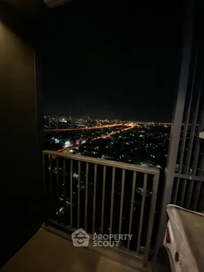 Stunning night city view from high-rise balcony, perfect for urban living.