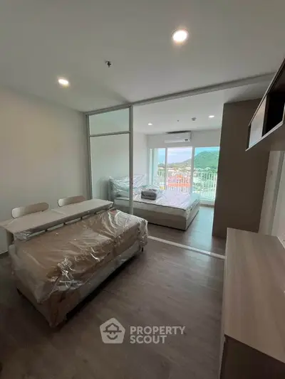 Modern apartment with open layout and scenic balcony view