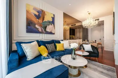 Luxurious living room with elegant decor and plush blue sofa