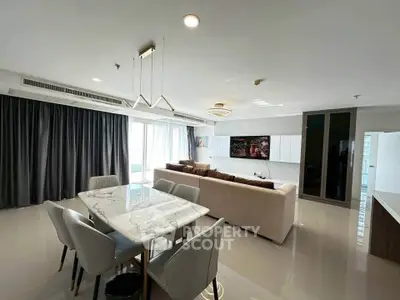 Spacious modern living room with elegant furniture and large windows