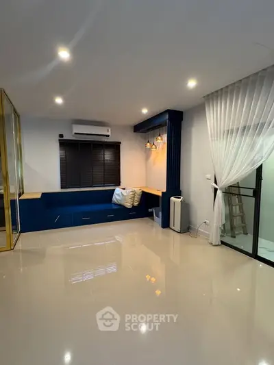 Spacious modern living room with sleek design and ample natural light