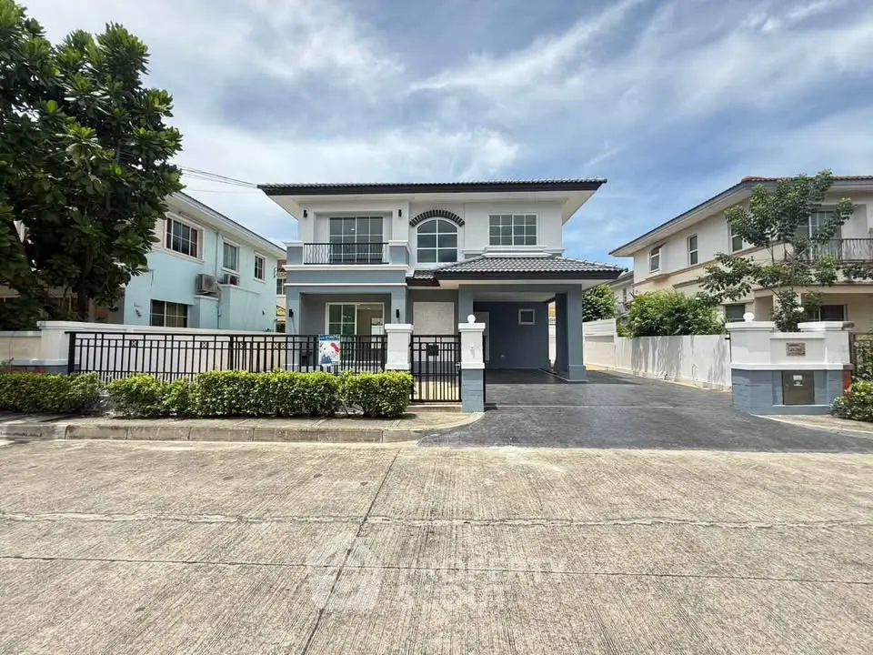 Stunning two-story house with modern design and spacious driveway in a serene neighborhood.