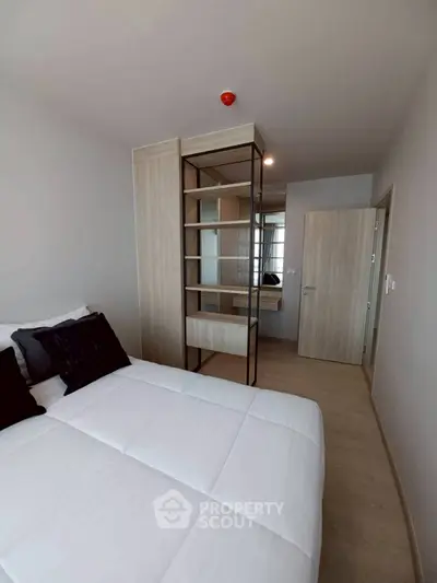 Modern bedroom with sleek design and built-in storage solutions