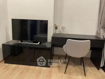 Modern living room with sleek TV stand and stylish desk setup