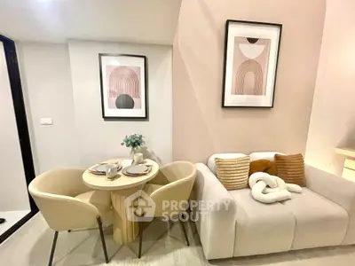Stylish modern living room with cozy sofa and elegant dining set, perfect for urban living.