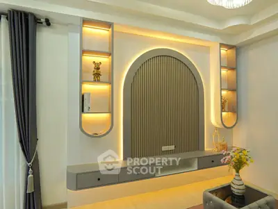 Elegant modern living room with stylish wall decor and ambient lighting