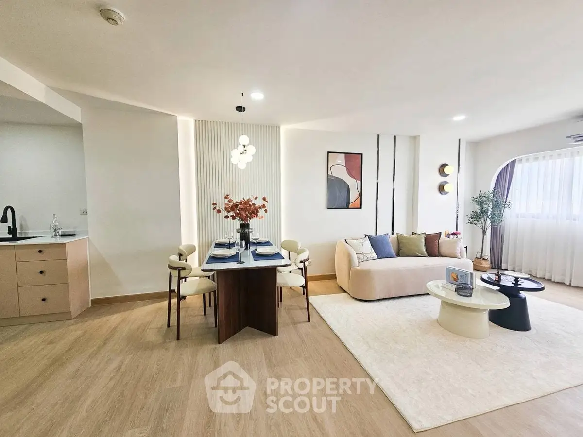 Spacious modern living room with elegant dining area and stylish decor
