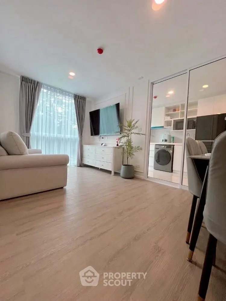 Modern living room with open kitchen and stylish decor