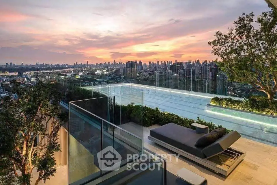 Luxurious rooftop pool with stunning city skyline view at sunset.