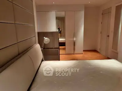 Modern bedroom with sleek design and ample storage space
