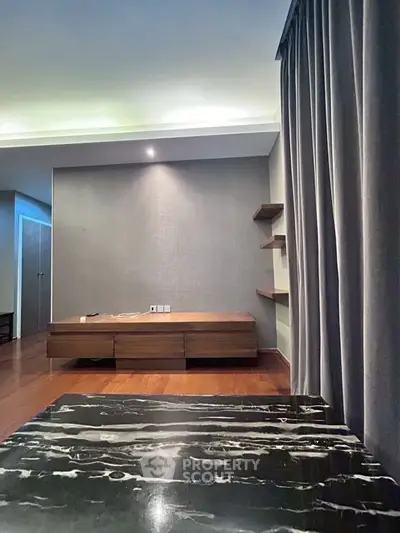 Modern minimalist living room with wooden floors and sleek furniture