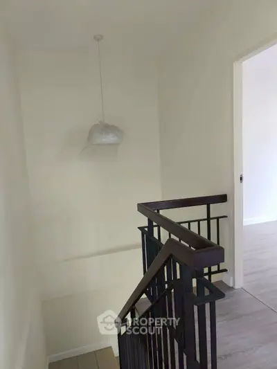 Modern staircase with sleek railing in a minimalist home interior