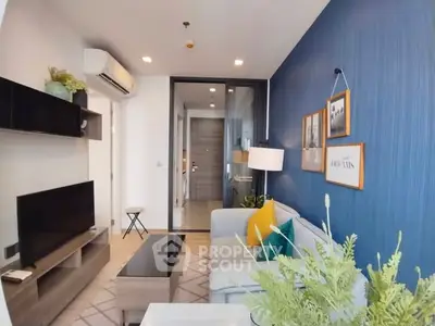 Modern living room with stylish decor and blue accent wall