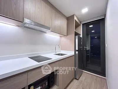 Modern kitchen with sleek cabinetry and stainless steel appliances