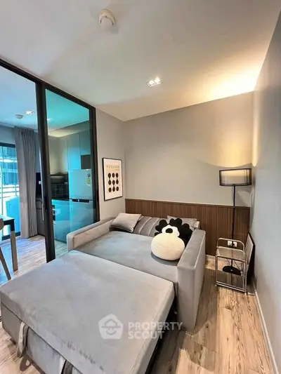 Modern living room with stylish decor and cozy sofa bed in a contemporary apartment.